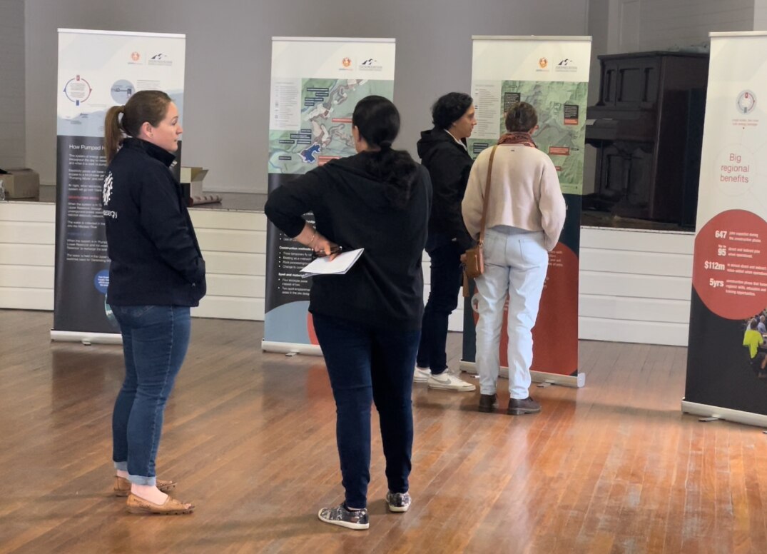 Alinta Energy's Community Engagement Manager talks to stakeholders at a project drop-in session.